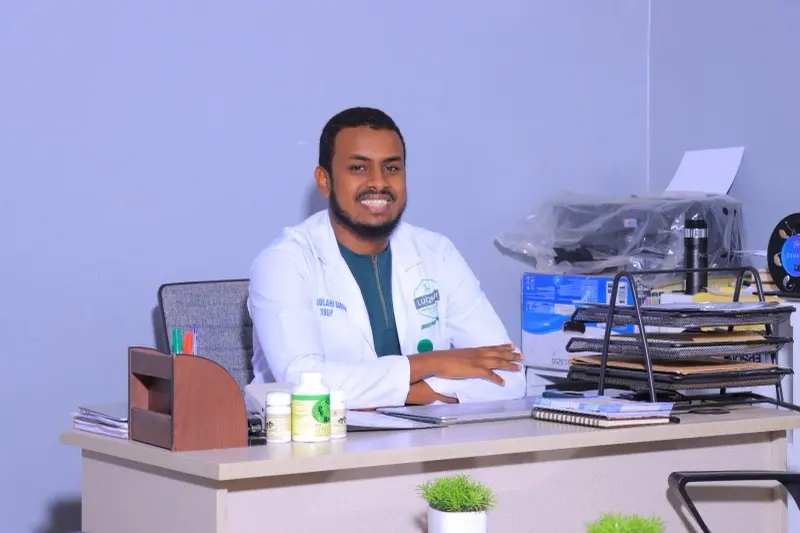 Dr Abdilahi Sadiq Yusuf at his desk in the consultation room