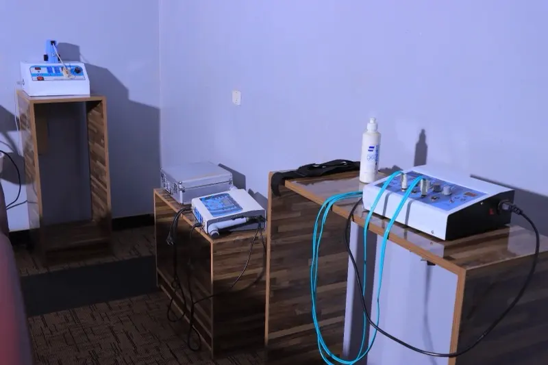 Electrotherapy and ultrasound units on wooden stands