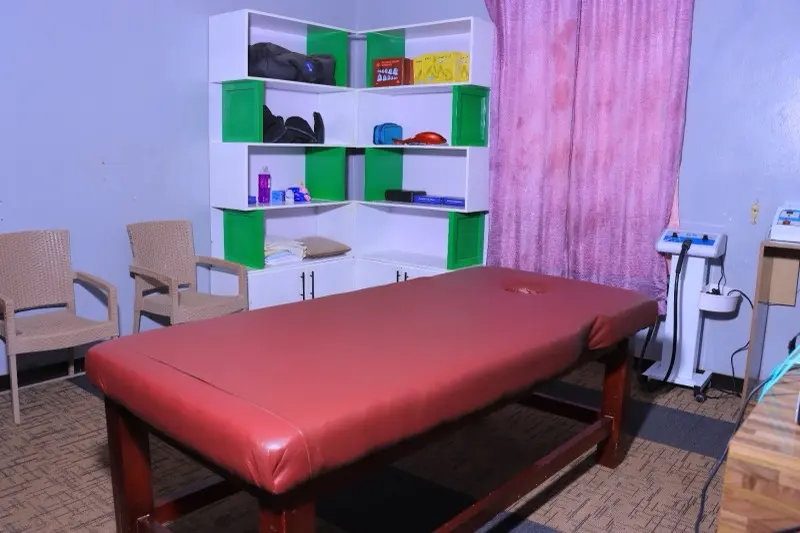 Treatment room with massage bed and cupping supplies